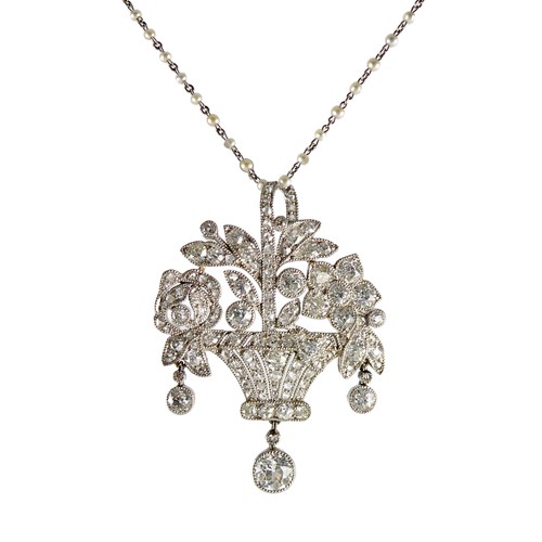 Early 20th century diamond flower basket pendant by Cartier, c.1915, on a seed pearl chain collar necklace,